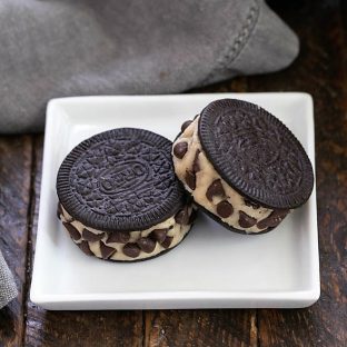 2 cookie dough stuffed Oreos on a square white plate