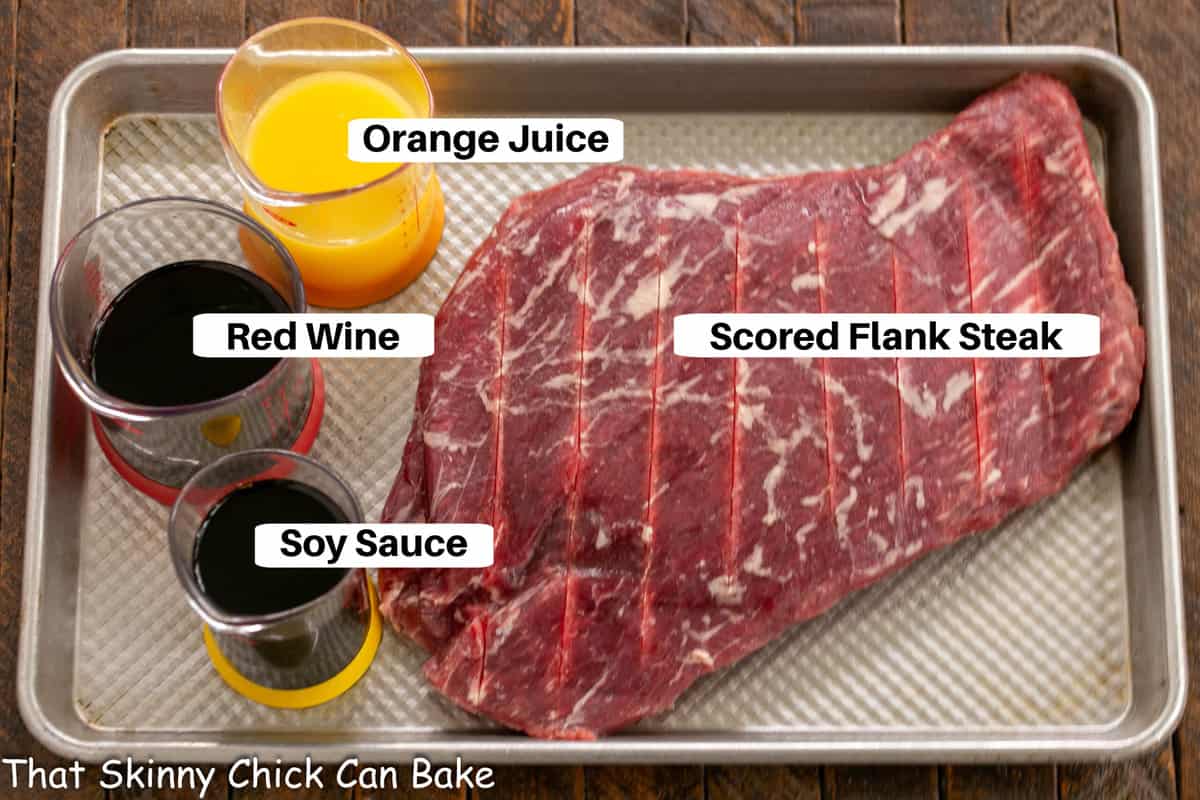 Flank Steak Marinade Ingredients on a sheet pan with labels.