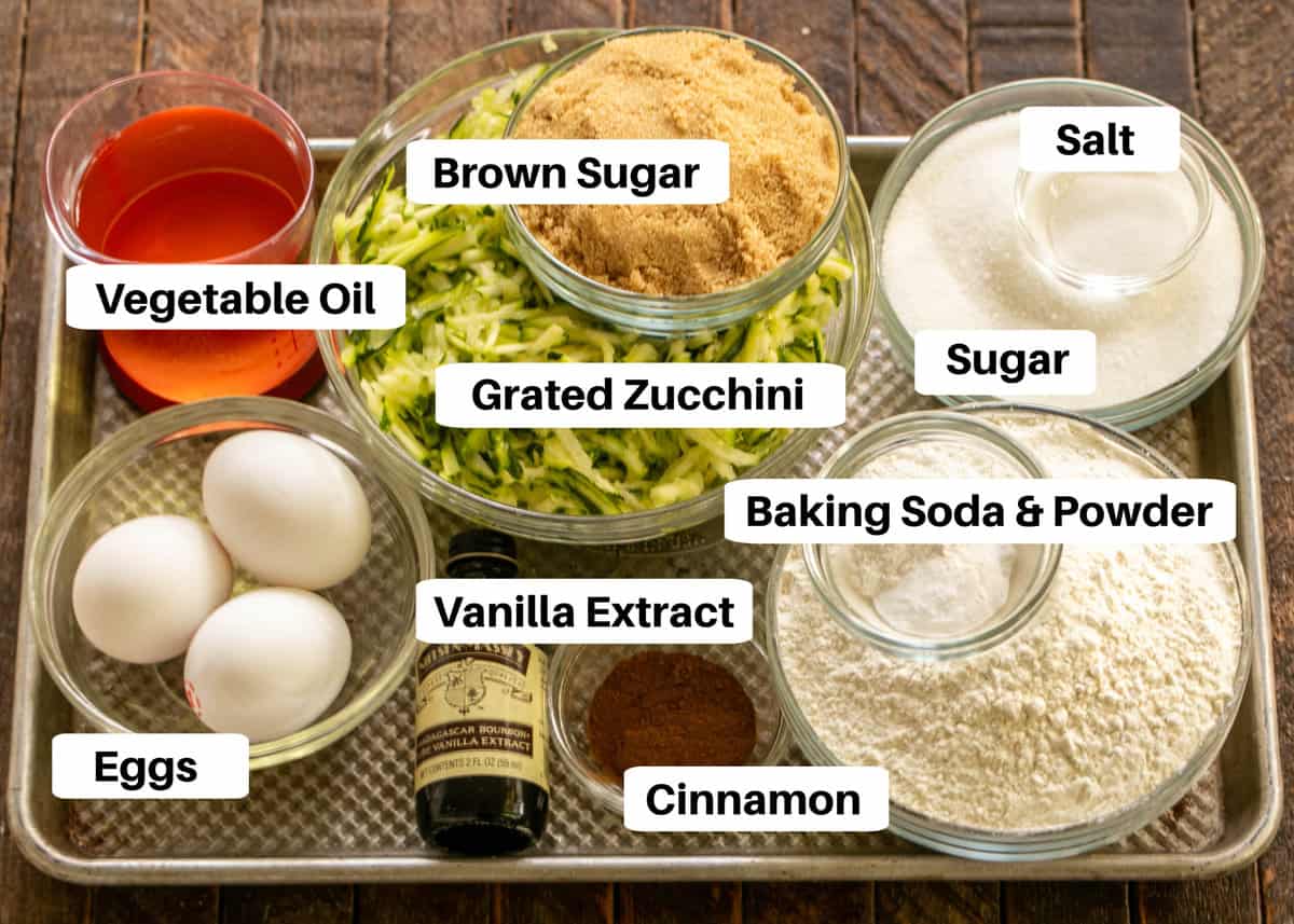 Zucchini bread ingredients  on a sheet pan with labels.