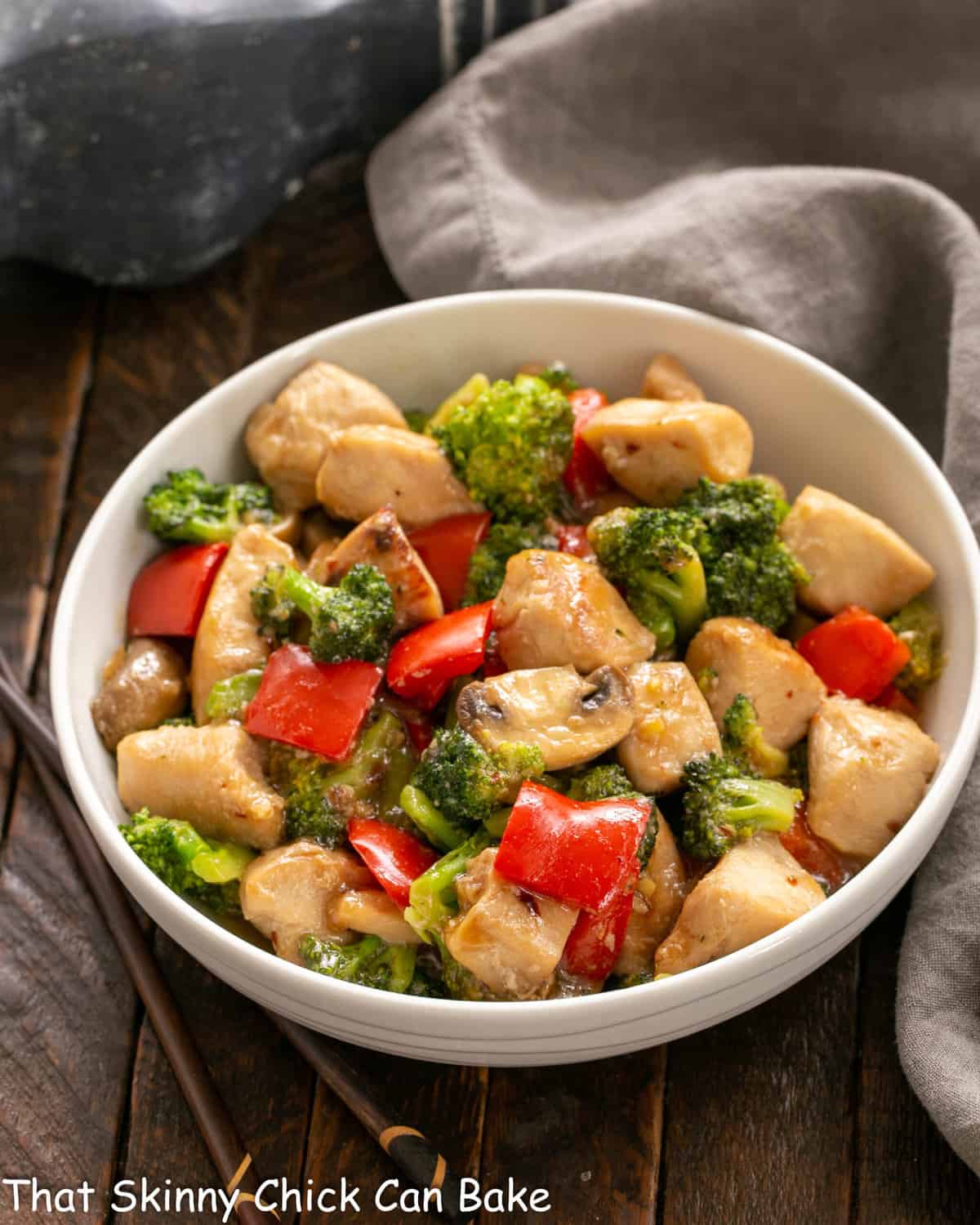 Chicken Broccoli Stir Fry in a white ceramic serving bowl.