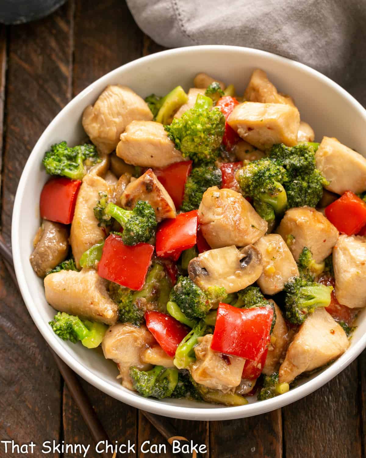 Overhead view of serving bowl full of chicken and broccoli stir fry.