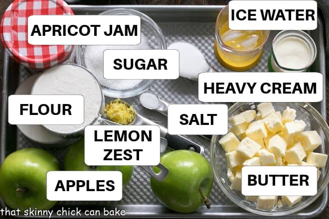 Ingredients for apple crostata on a sheet pan with labels.
