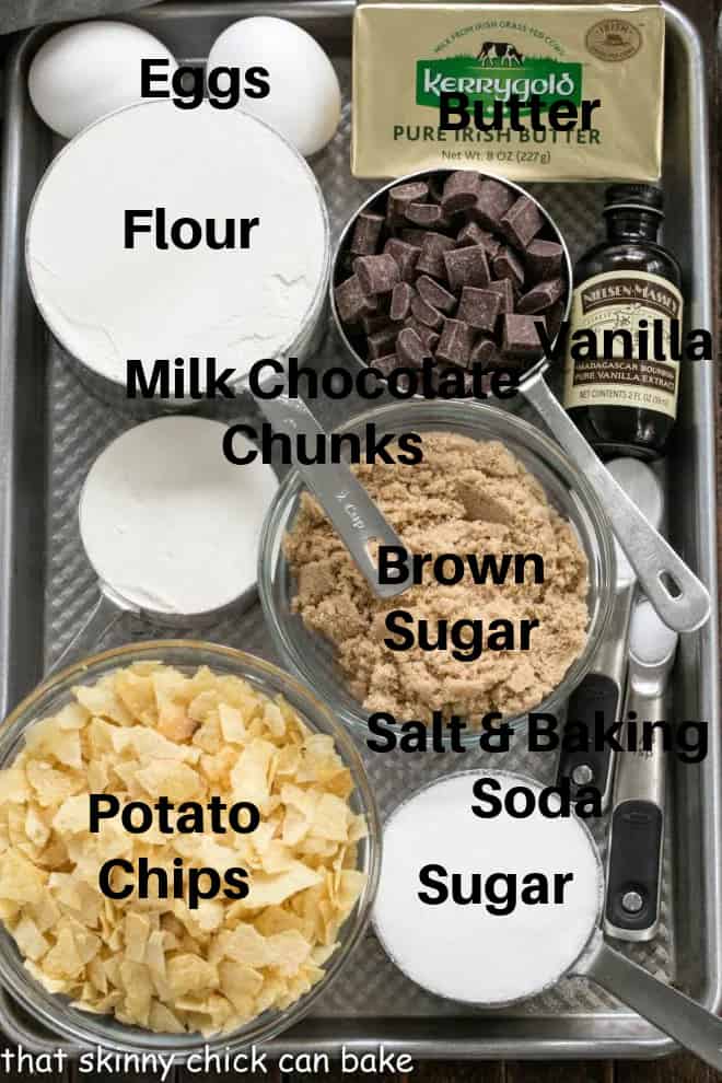 Chocolate Chunk Potato Chip Cookie ingredients labeled on a sheet pan.