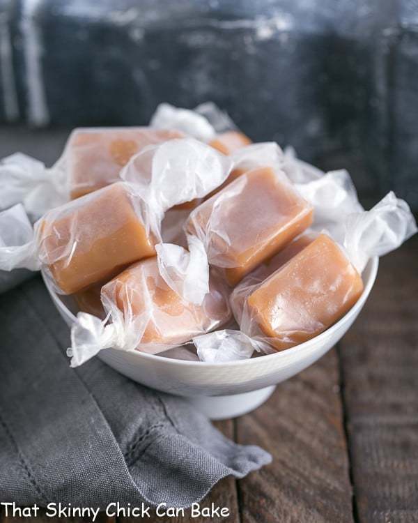 Wrapped Caramels in a white bowl.