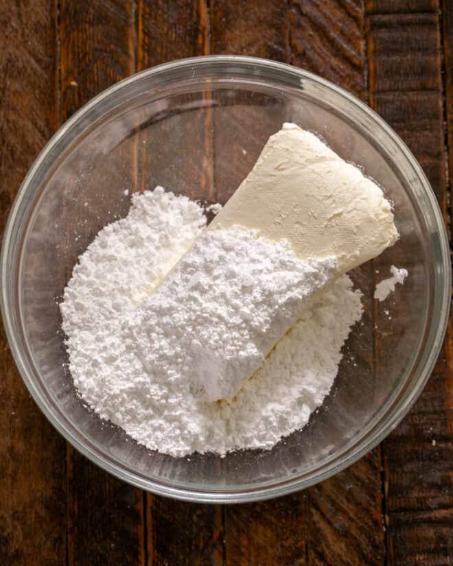 Cream cheese and powdered sugar in a mixing bowl