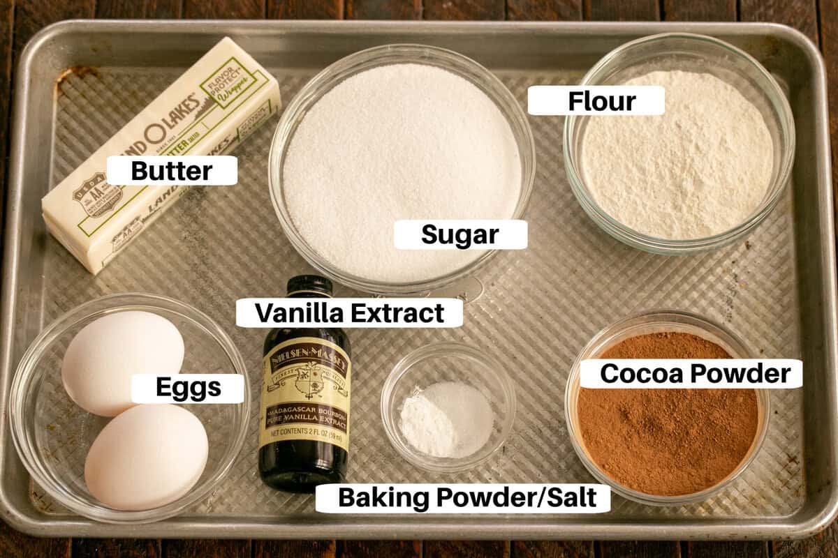 Frosted Brownies Ingredients with labels on a sheet pan with labels.