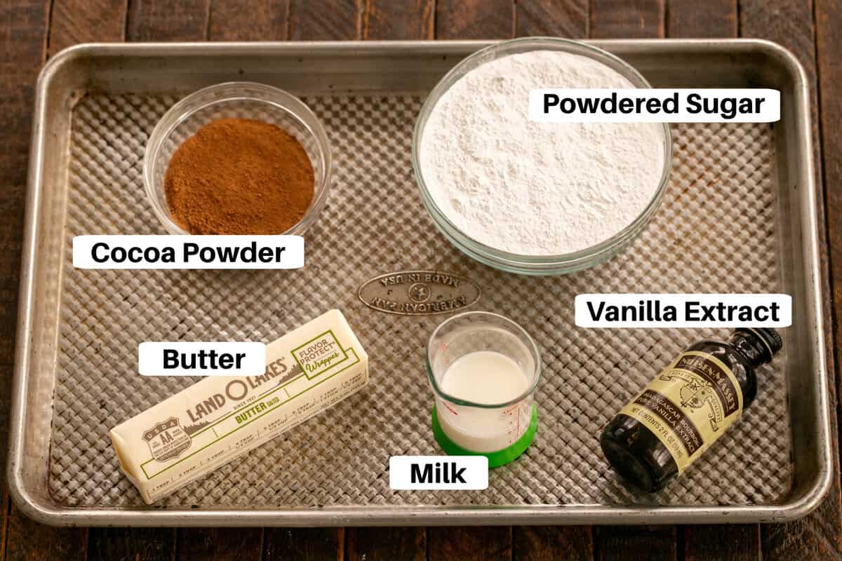 Frosting ingredients for Frosted Brownies ingredients on a sheet pan.