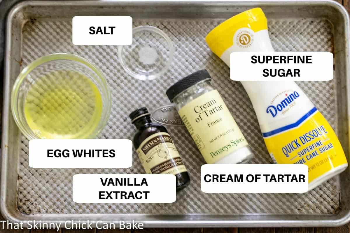 Meringue Cookie Ingredients on a metal sheet pan with labels.