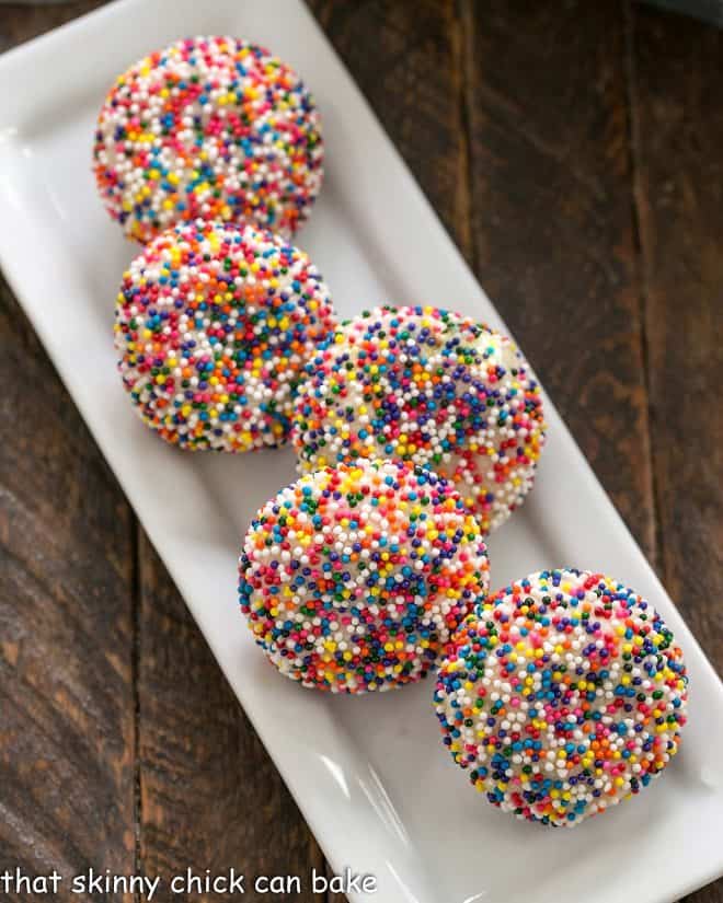 Sprinkle cookies on a white rectangular tray