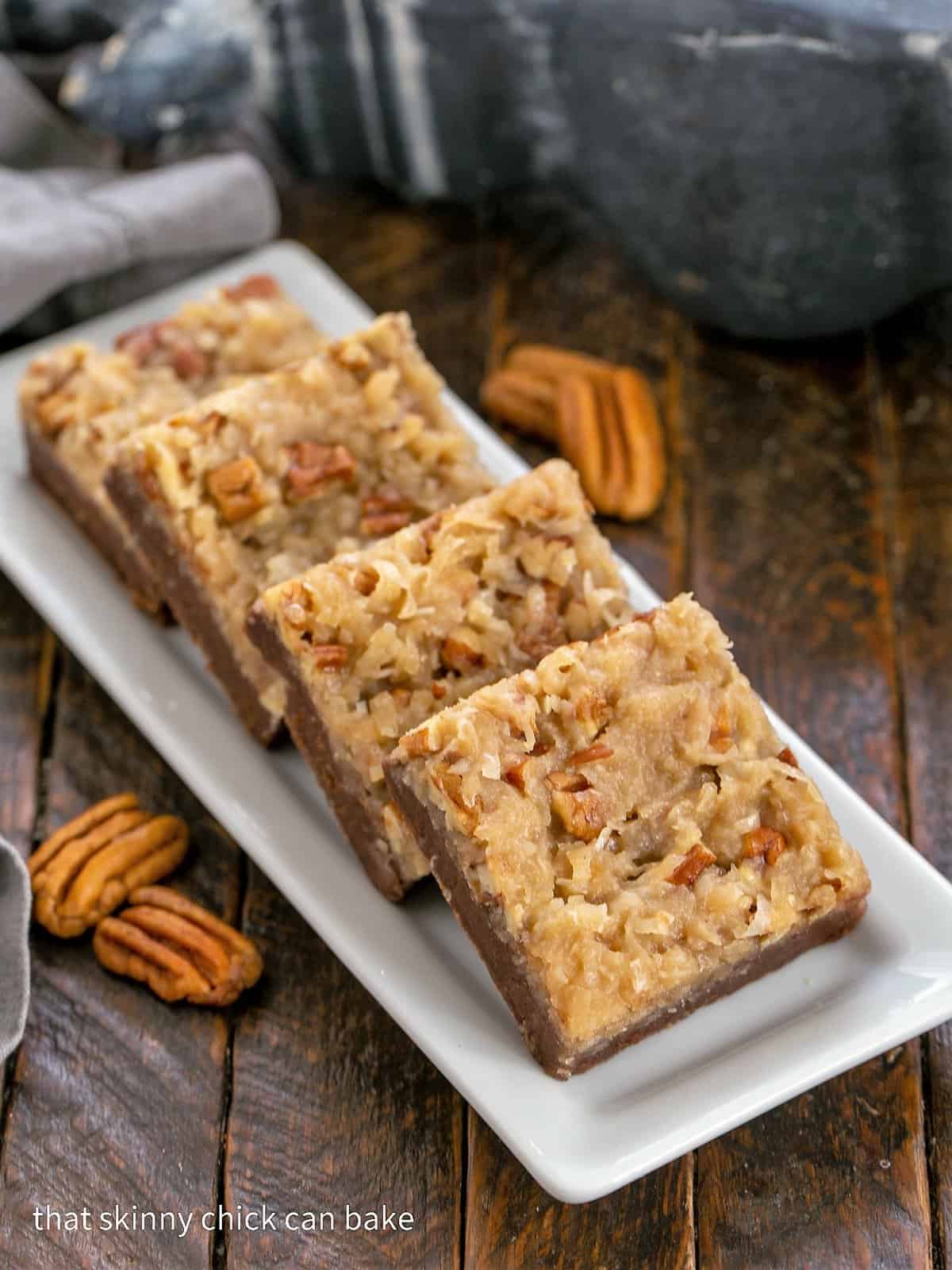 4 German Chocolate Brownies on a white tray.