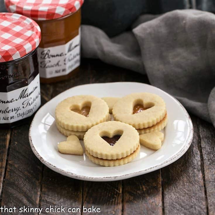 Linzer cookies on a white dessert plate