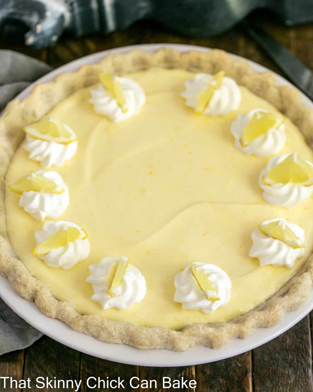 Lemon chiffon pie in a white pie plate from above.