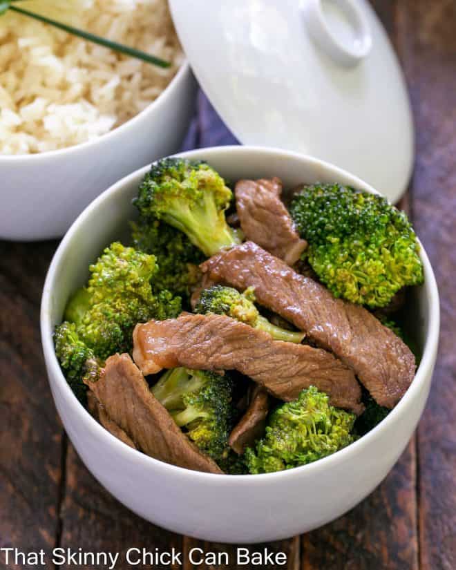 Overhead view of beef stir fry and rice in white ceramic bowlx