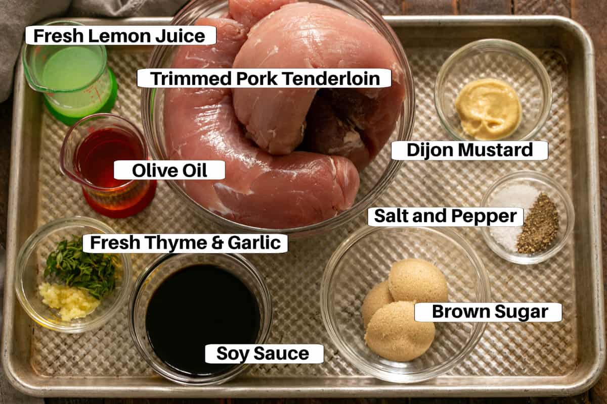 Easy Pork Tenderloin Marinade Ingredients on a sheet pan with labels.