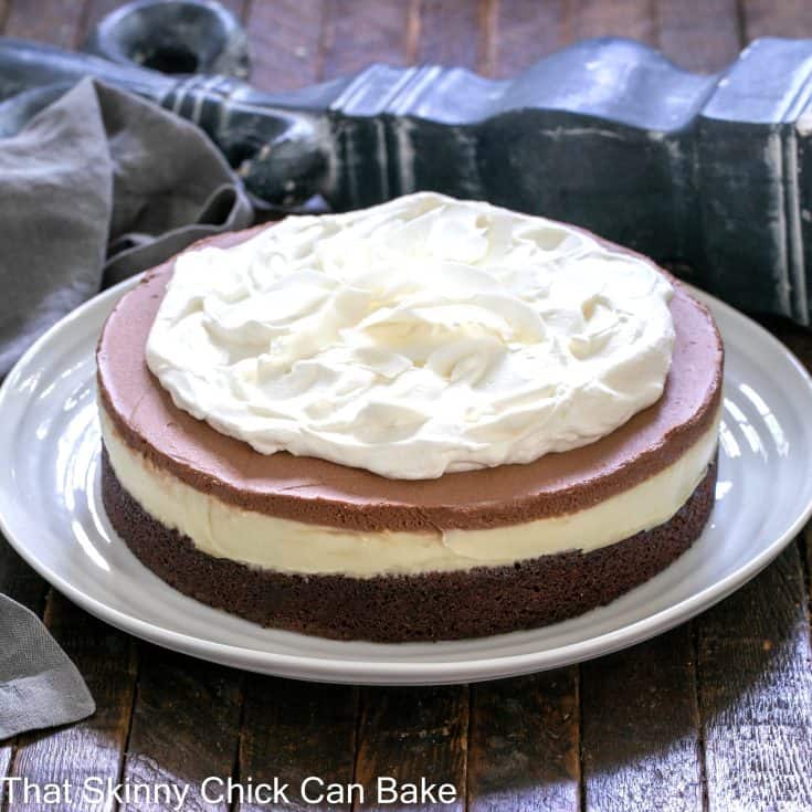 Coconut Brownie Cake on a white ceramic plate.