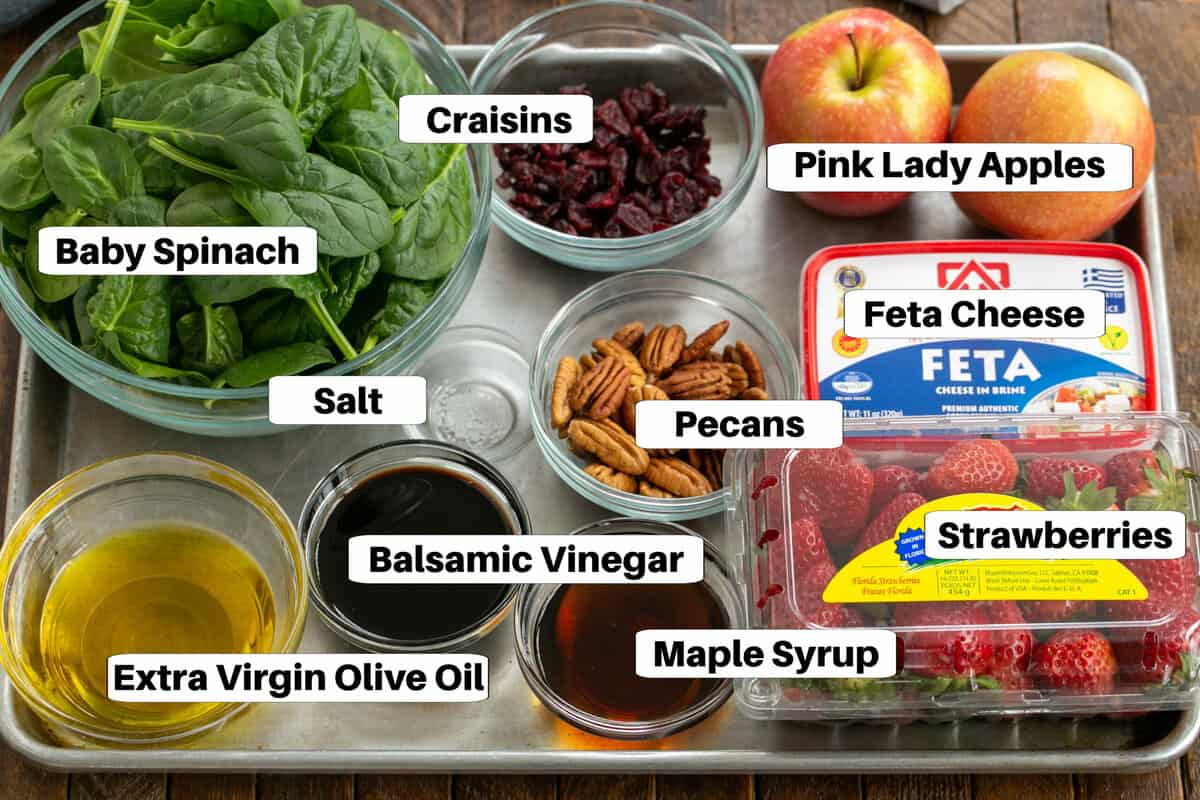 Spinach Salad with Strawberries and Feta ingredients on a metal sheet pan with labels.