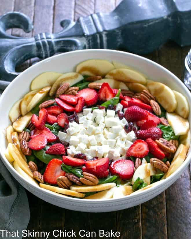 Strawberry Spinach Salad in a white serving bowl