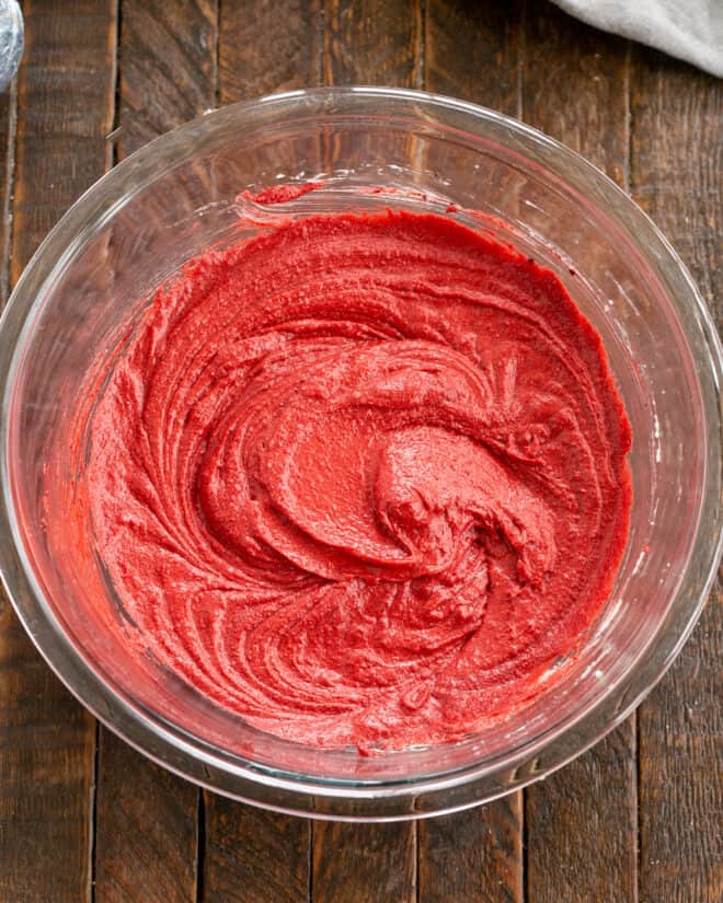 Red velvet paste mixed into batter.