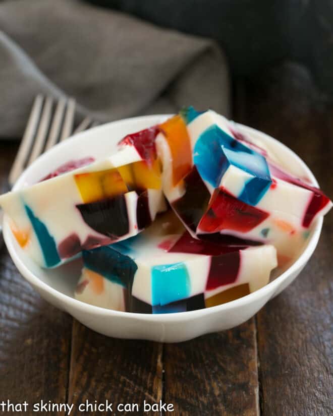 Broken Glass Jello squares in a small white dish.