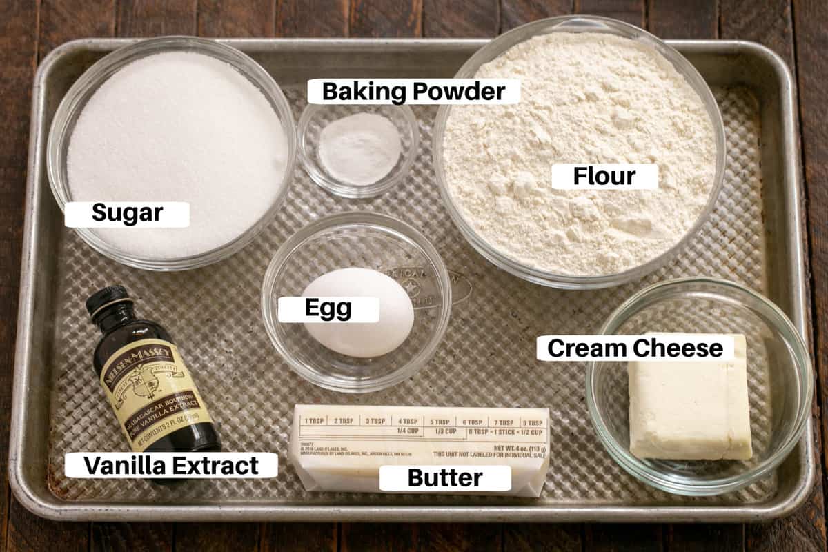 Sugar Cookie Ingredients with labels on a metal sheet pan.