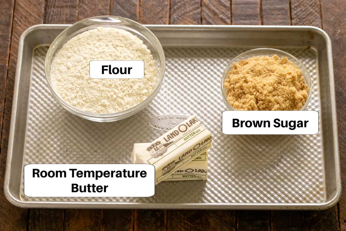 Truffle brownie crust ingredients with labels on a sheetpan.