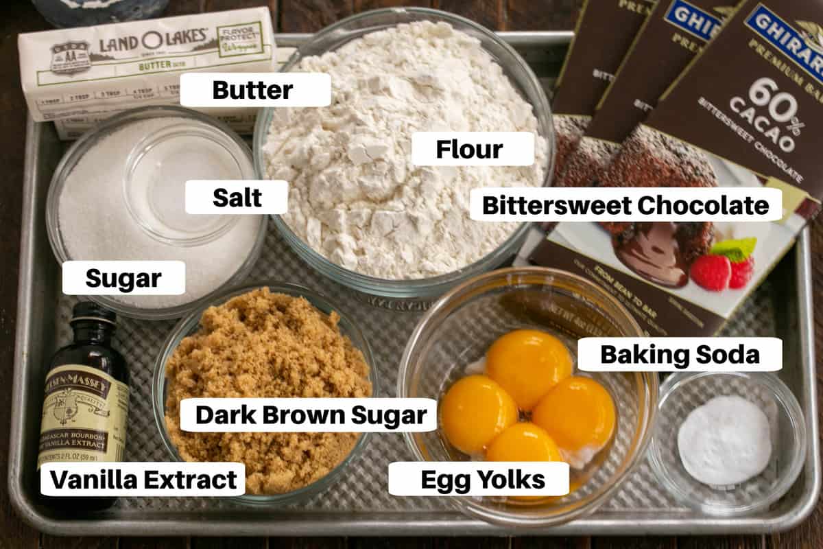 Layered Chocolate Chip Cookie Ingredients with labels on a sheet pan.