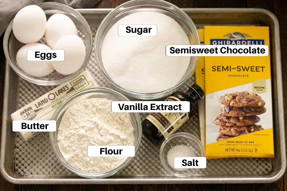 Fudgy brownies ingredients with labels on a metal sheetpan.