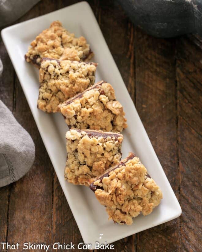 Date bars on a white ceramic tray.