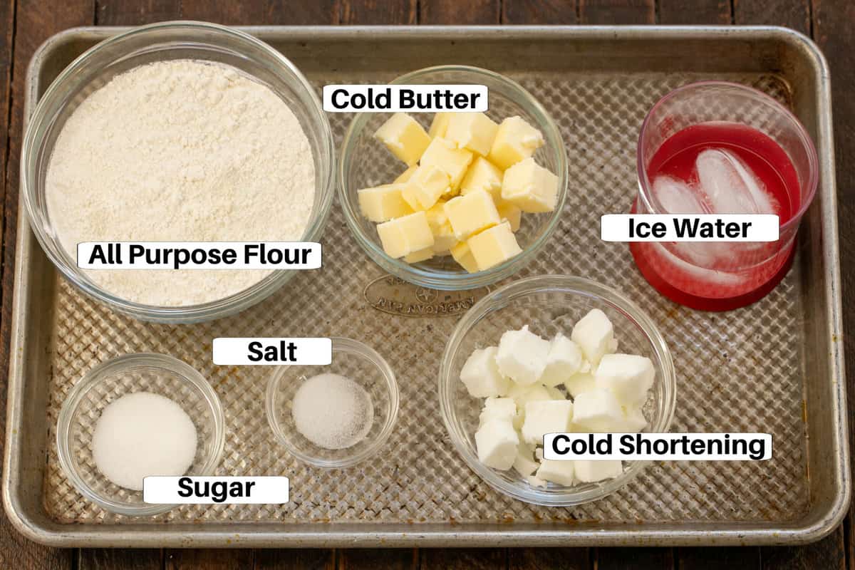 Pie Crust Ingredients with labels on a sheet pan.