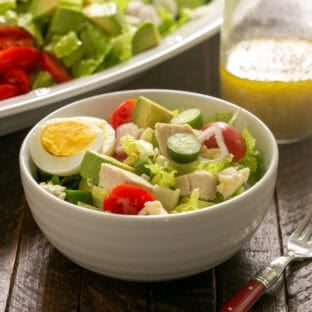 Cobb salad in a white ceramic salad bowl.