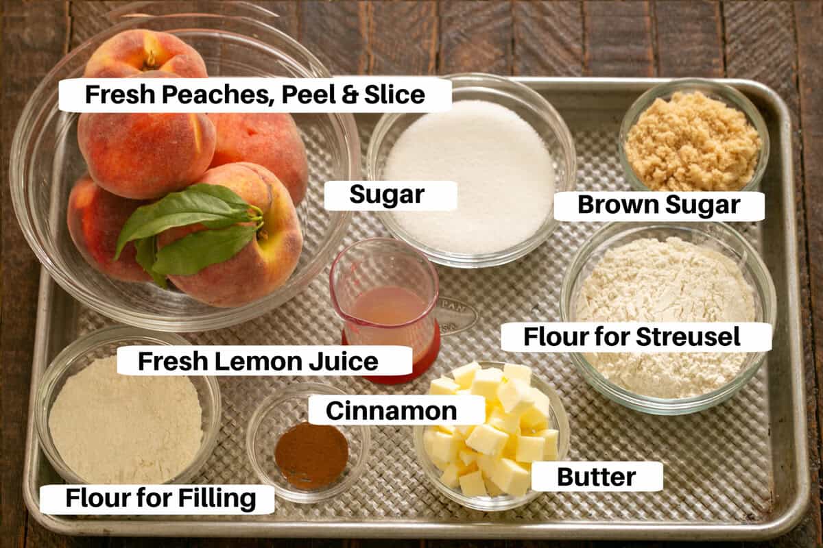 Peach Tart Filling and Streusel Ingredients with labels on a metal sheetpan.