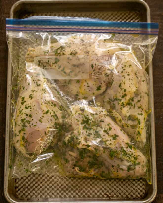 Marinating chicken piccata in a ziploc bag.