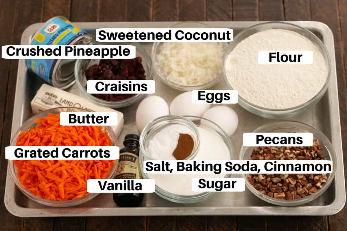 Morning glory muffin ingredients on a sheet pan with labels.